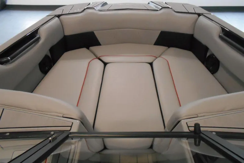 Slide: The Image of 2023 Moomba Max boat interior with cushioned seating and sleek design. - 17