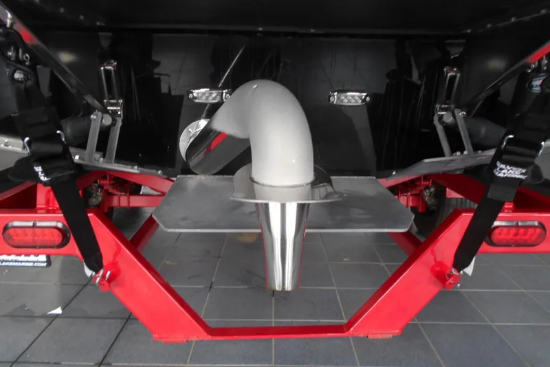 Slide: The Image of 2023 Moomba Max boat trailer with red frame and exhaust system. - 6