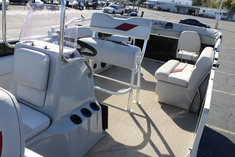 Slide: The Image of 2021 SunCatcher Select 22C boat interior with seating and steering console. - 13