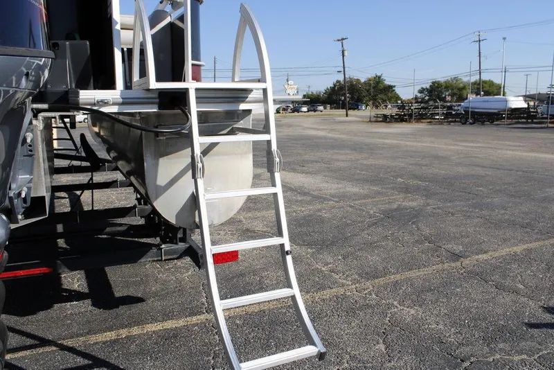 Slide: The Image of 2021 SunCatcher Select 22C pontoon boat with aluminum ladder in a parking lot. - 27