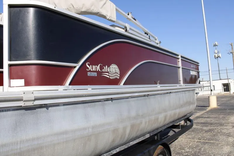 Slide: The Image of 2021 SunCatcher Select 22C pontoon boat on trailer, side view. - 4