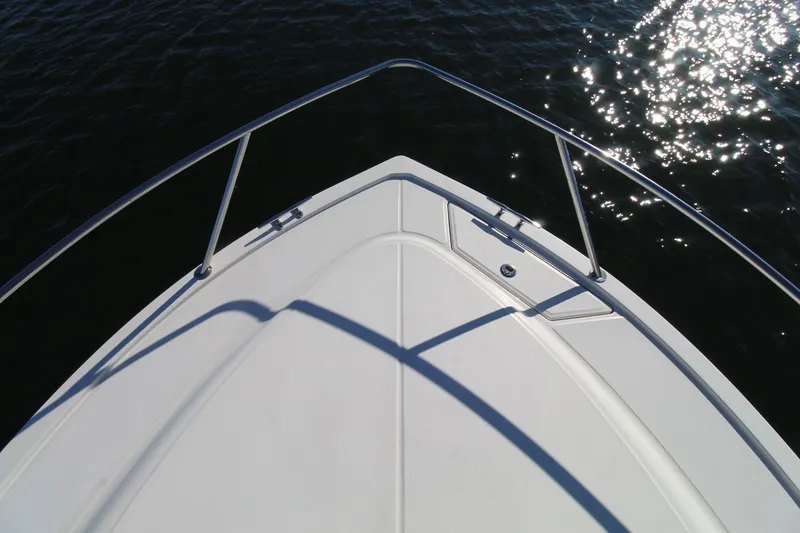 Slide: The Image of Bow of 2022 Albemarle 30 Express boat on water with sunlight reflections. - 12