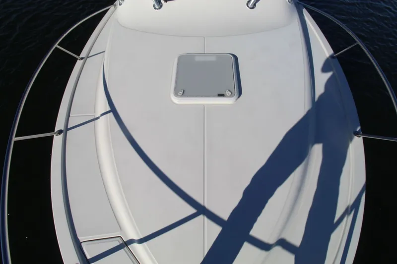 Slide: The Image of 2022 Albemarle 30 Express boat deck with hatch, surrounded by railing. - 13
