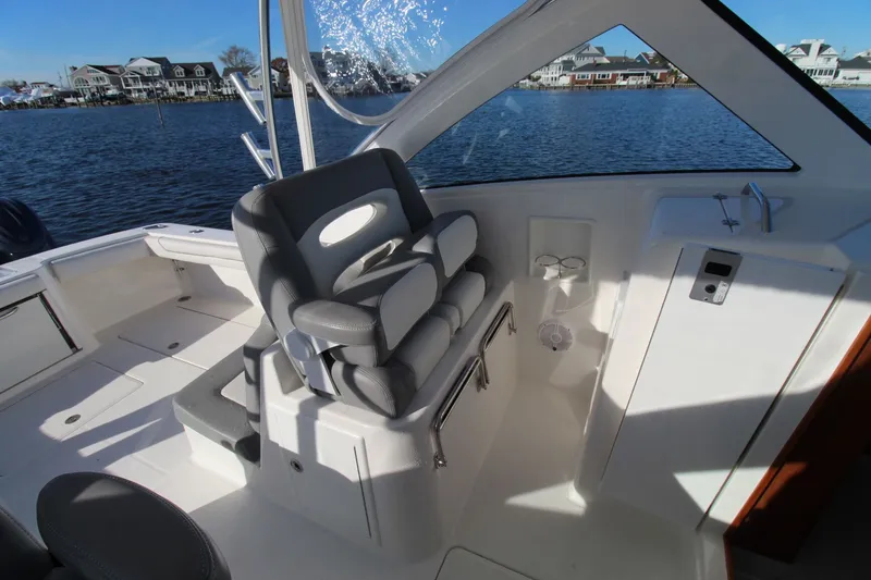 Slide: The Image of 2022 Albemarle 30 Express boat interior with seating and water view. - 22