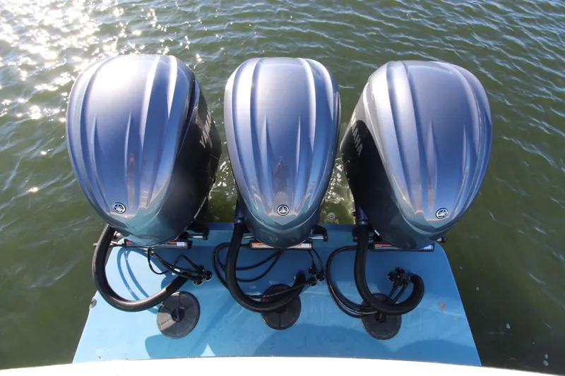 Slide: The Image of Triple Yamaha outboard engines on a 2022 Albemarle 30 Express boat, viewed from above. - 23