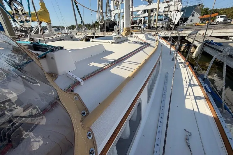 Slide: The Image of 1984 Sabre 34-1 sailboat docked at marina, rear view. - 12