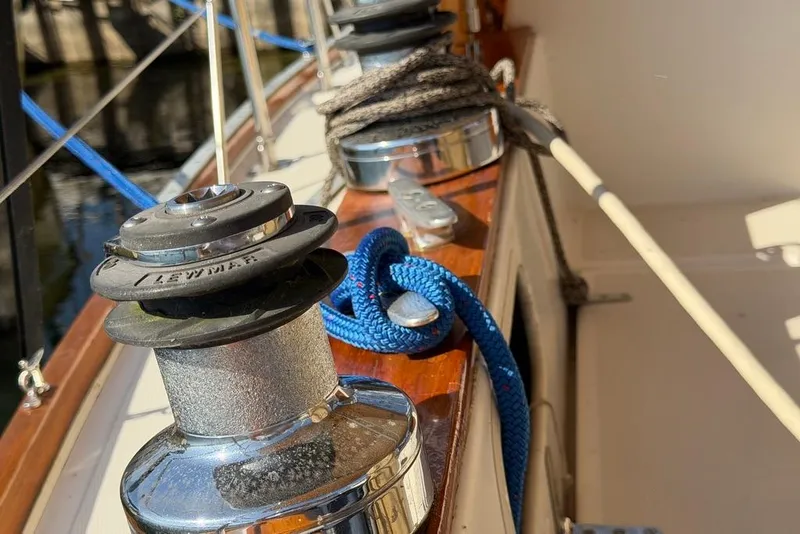 Slide: The Image of Sailing on a 1984 Sabre 34-1 with navigation equipment and scenic ocean view. - 22