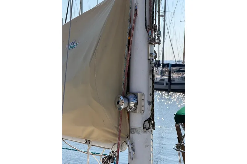 Slide: The Image of 1984 Sabre 34-1 sailboat mast with rigging and sail cover in marina. - 26