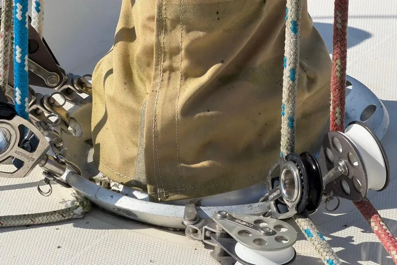 Slide: The Image of Close-up of sailing rigging on a 1984 Sabre 34-1 yacht, featuring ropes and pulleys. - 29