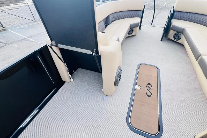 Slide: The Image of 2024 Harris Sunliner 250 interior with beige seating and modern flooring. - 28