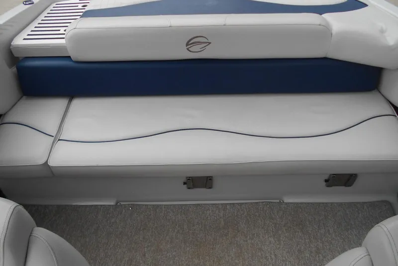Slide: The Image of 2012 Crownline 205 SS boat interior seating with blue and white upholstery. - 12