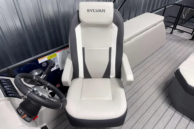 Slide: The Image of Captain's chair in 2026 Sylvan Mirage X3 CLZ DH boat, featuring sleek design and modern controls. - 10