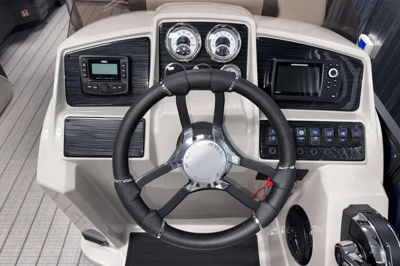 Slide: The Image of Steering console of 2026 Sylvan Mirage X3 CLZ DH with modern controls and displays. - 11