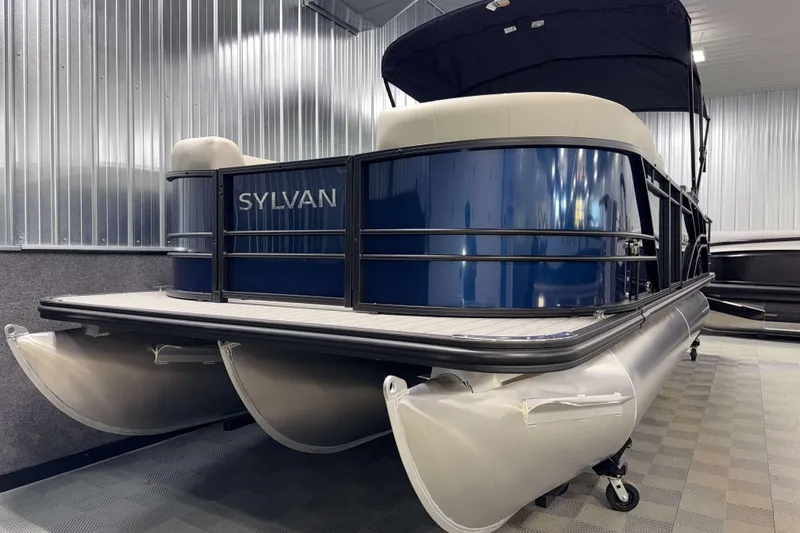 Slide: The Image of 2026 Sylvan Mirage X3 CLZ DH pontoon boat in showroom, featuring sleek design and modern amenities. - 20