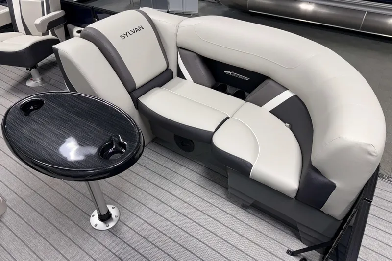 Slide: The Image of Luxurious seating on 2026 Sylvan Mirage X3 CLZ DH pontoon boat with sleek table design. - 3
