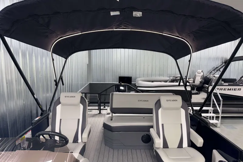 Slide: The Image of 2026 Sylvan Mirage X3 CLZ DH pontoon boat interior with canopy and seating. - 6