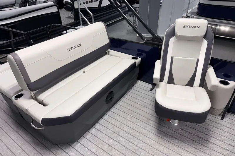 Slide: The Image of 2026 Sylvan Mirage X3 CLZ DH boat seating, featuring luxurious white and gray upholstery. - 8