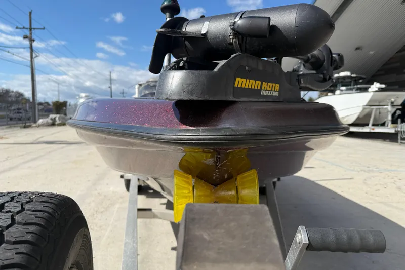 Slide: The Image of 2000 Triton Tr-186 boat with Minn Kota trolling motor on trailer. - 3