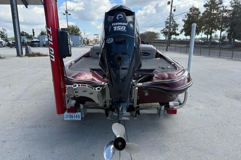 Slide: The Image of Rear view of a 2000 Triton Tr-186 boat with Evinrude 150 engine. - 6