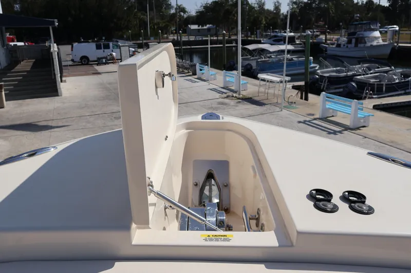 Slide: The Image of 2017 Grady-White Canyon 306 boat anchor compartment at marina. - 58