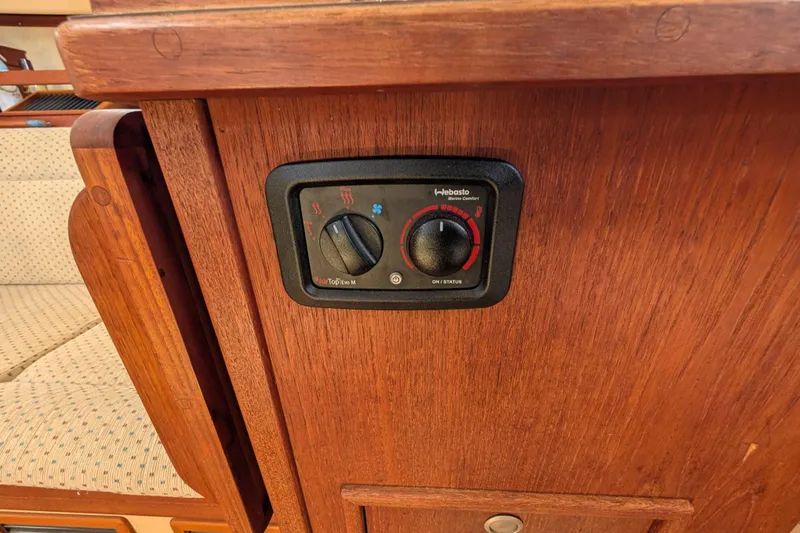 Slide: The Image of Control panel on 1999 Island Packet 320 sailboat, featuring Webasto heater settings. - 17
