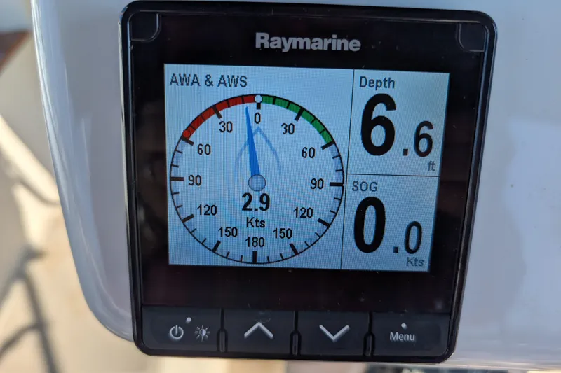 Slide: The Image of Raymarine display showing wind speed, depth, and speed on Island Packet 320, 1999 model. - 26