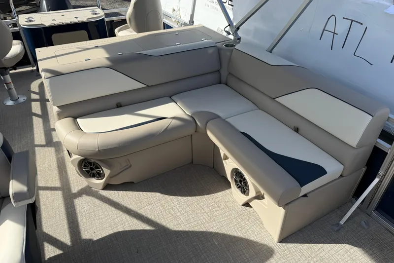 Slide: The Image of Luxurious seating on 2026 Avalon Venture 85 Rear Fish pontoon boat, featuring integrated speakers. - 10