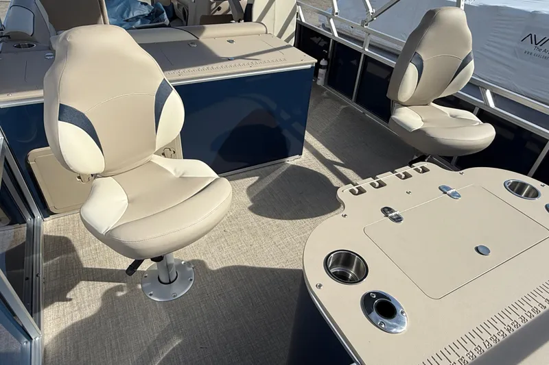 Slide: The Image of 2026 Avalon Venture 85 Rear Fish boat interior with beige seating and fishing table. - 14