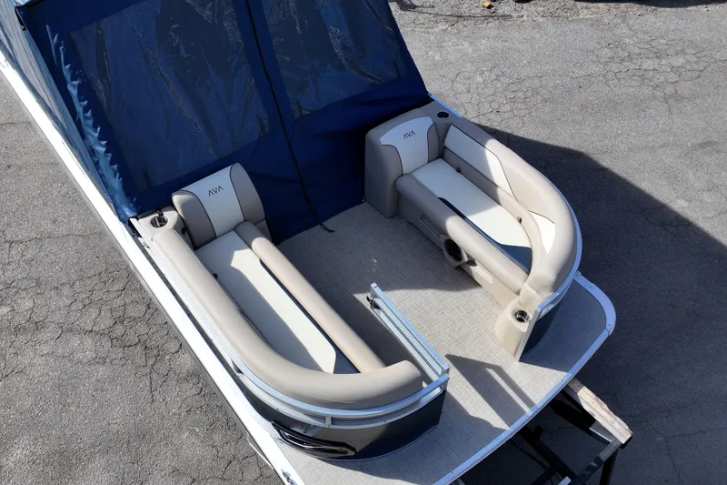 Slide: The Image of 2026 Avalon Venture 85 Rear Fish boat with beige seating and blue canopy. - 6