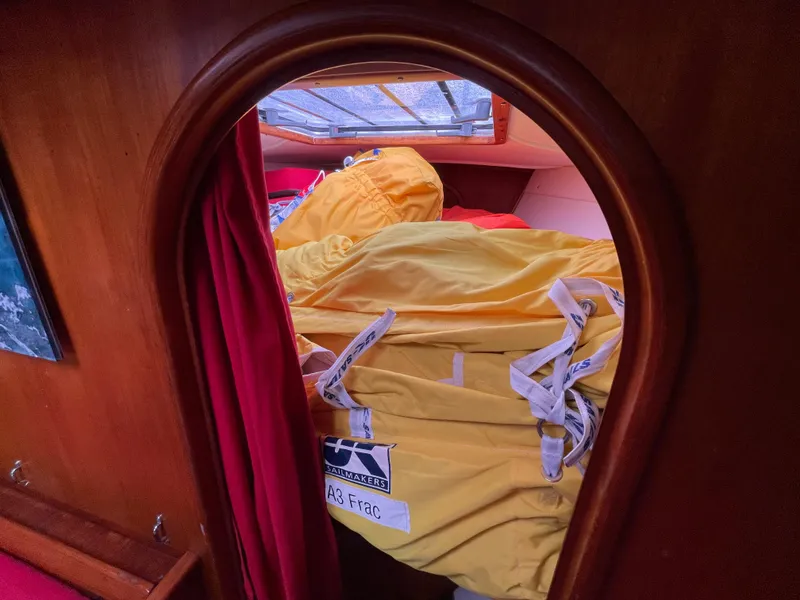 Slide: The Image of Interior of 1980 Davidson 44 yacht with wooden finish and compact kitchen area. - 21