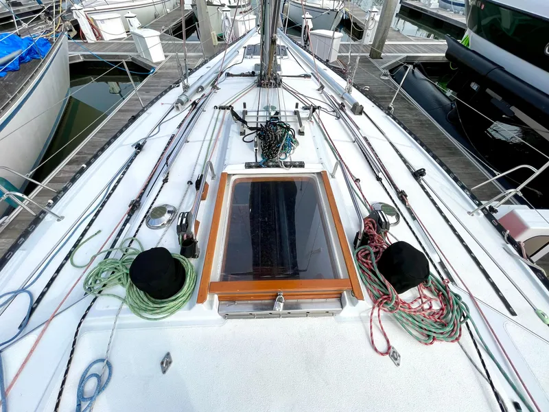 Slide: The Image of Cockpit view of 1980 Davidson 44 sailboat with steering wheel and deck equipment. - 5