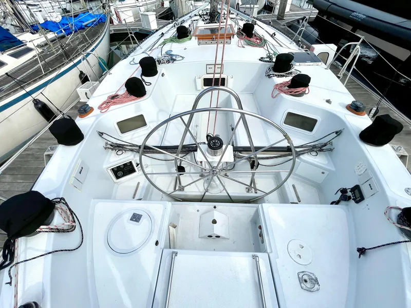 Slide: The Image of Cockpit view of 1980 Davidson 44 sailboat with steering wheel and deck equipment. - 4