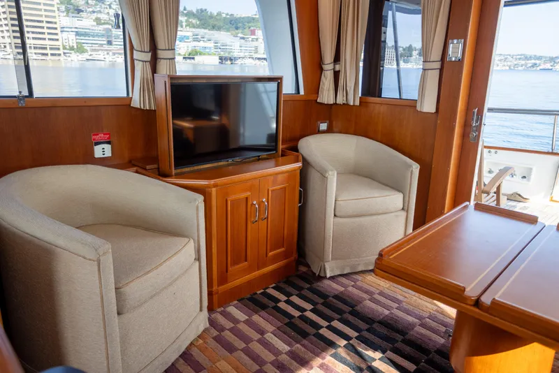 Slide: The Image of Interior of 2006 Grand Banks 47 Europa yacht with cozy seating and TV. - 10