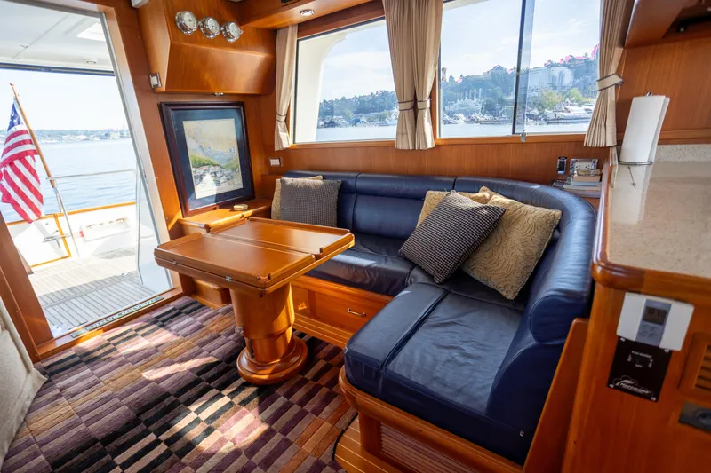 Slide: The Image of Luxurious 2006 Grand Banks 47 Europa yacht interior with plush seating and scenic views. - 11
