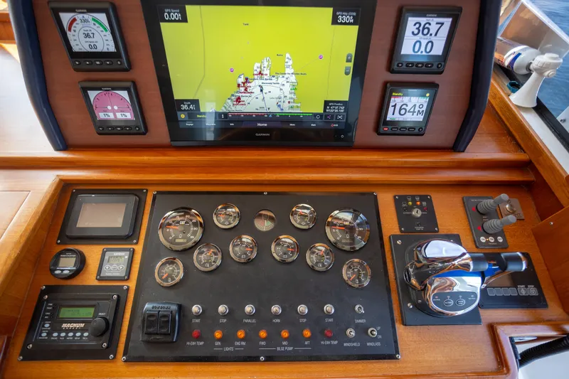 Slide: The Image of Control panel of a 2006 Grand Banks 47 Europa yacht with navigation and engine gauges. - 18