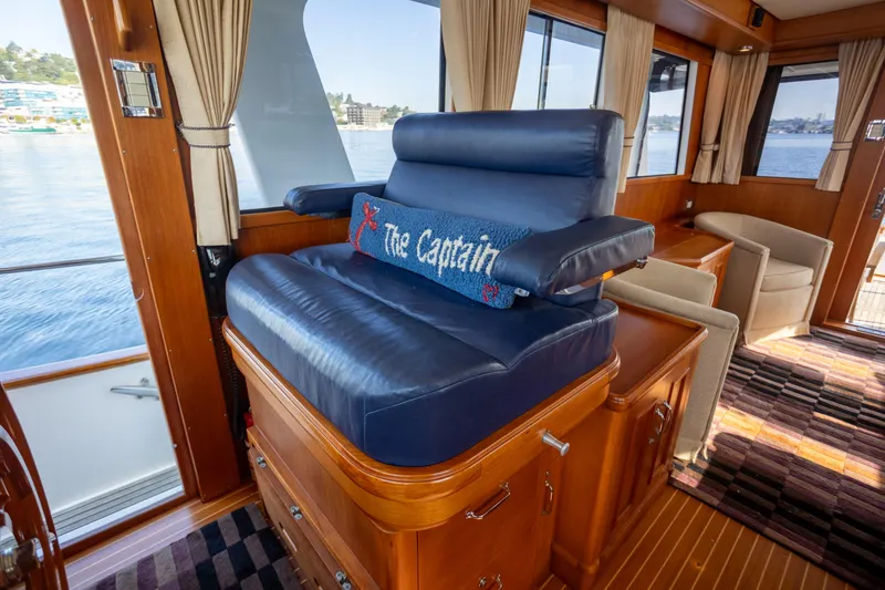 Slide: The Image of Luxurious interior of 2006 Grand Banks 47 Europa yacht with captain's chair and scenic view. - 20