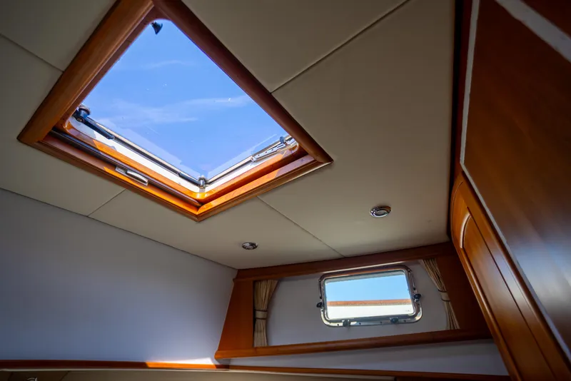 Slide: The Image of Interior view of 2006 Grand Banks 47 Europa yacht with skylight and window. - 22