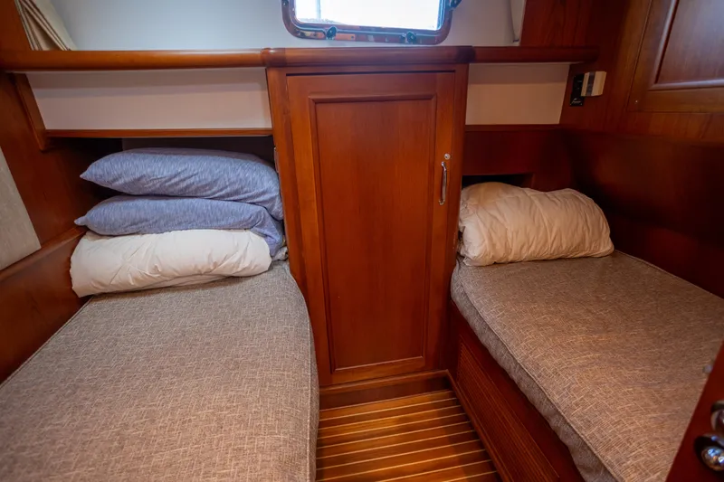 Slide: The Image of Cozy twin cabin in 2006 Grand Banks 47 Europa yacht with wooden interior. - 24