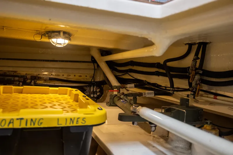 Slide: The Image of Engine room of 2006 Grand Banks 47 Europa with storage and mechanical components. - 30