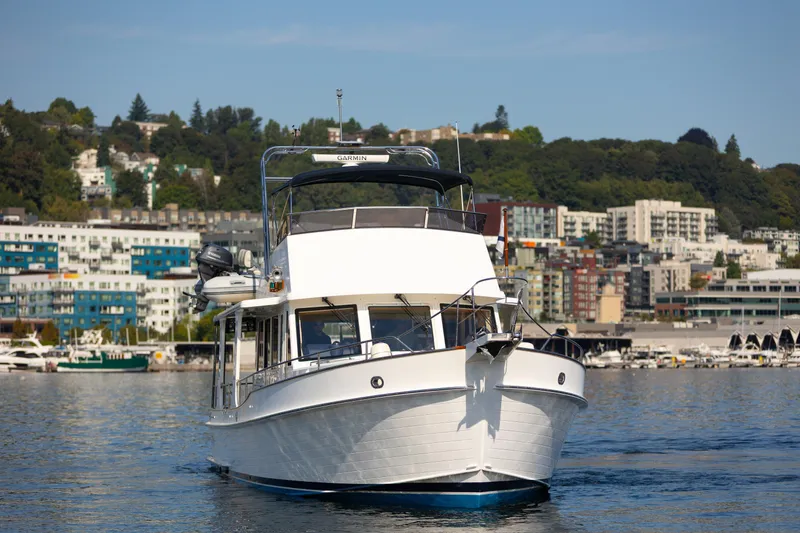 Slide: The Image of 2006 Grand Banks 47 Europa yacht cruising in a scenic harbor setting. - 4