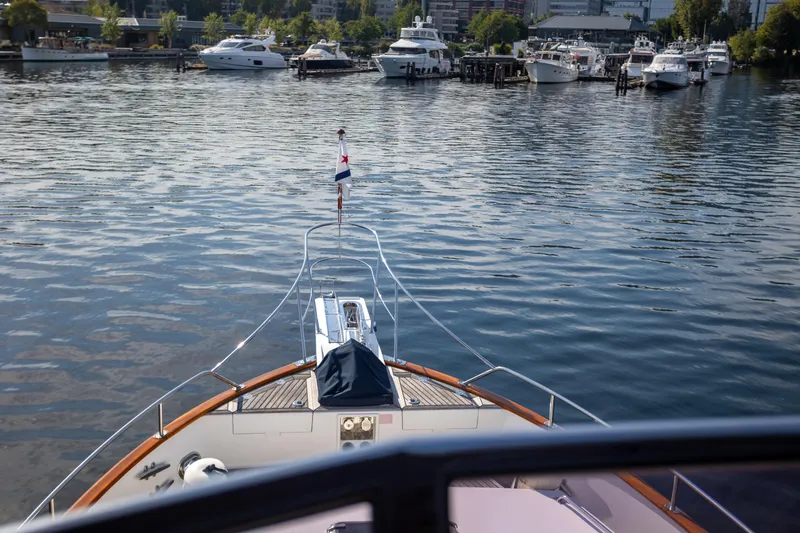 Slide: The Image of Bow view of 2006 Grand Banks 47 Europa yacht in a marina setting. - 44