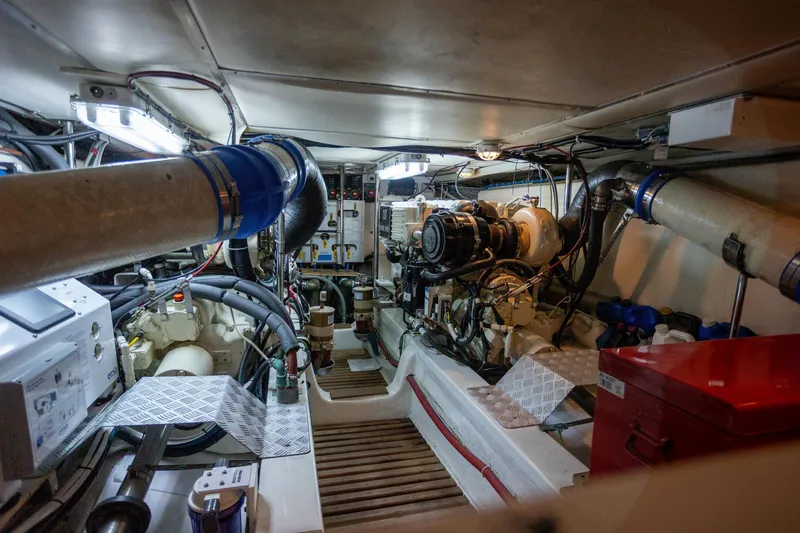 Slide: The Image of Engine room of a 2006 Grand Banks 47 Europa yacht, showcasing mechanical components and systems. - 7