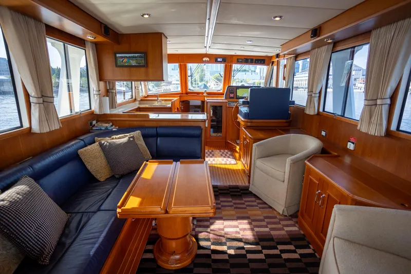 Slide: The Image of Luxurious interior of 2006 Grand Banks 47 Europa yacht with elegant wood finishes and comfortable seating. - 8