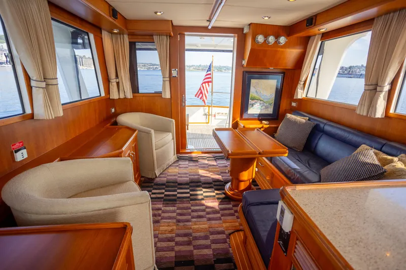 Slide: The Image of Luxurious 2006 Grand Banks 47 Europa yacht interior with elegant seating and scenic water views. - 9