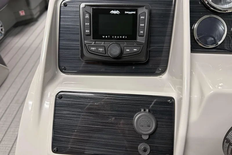 Slide: The Image of Control panel of 2026 Sylvan MIRAGE X3 DLZ BAR with audio system and gauges. - 12