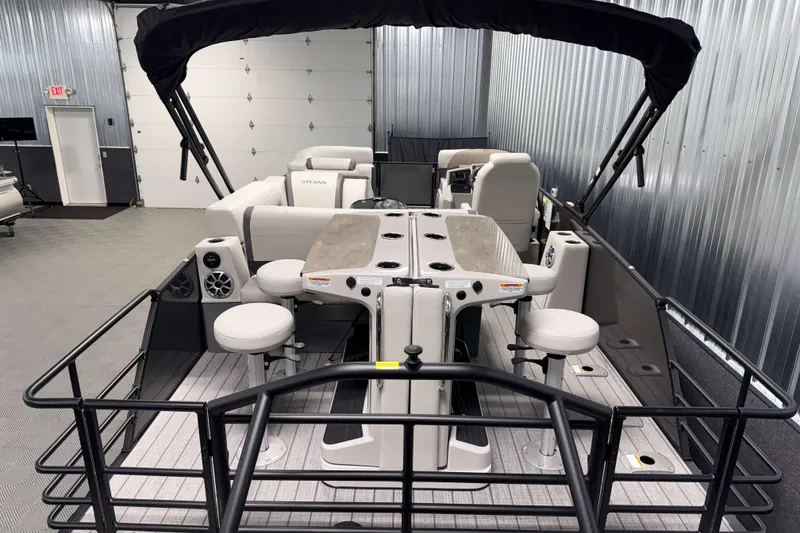 Slide: The Image of 2026 Sylvan MIRAGE X3 DLZ BAR pontoon boat interior with seating and bar area. - 17