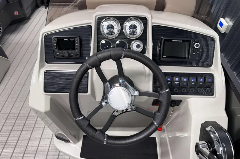 Slide: The Image of Steering console of 2026 Sylvan MIRAGE X3 DLZ BAR boat with modern controls and gauges. - 9