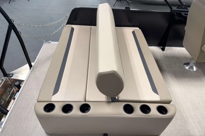 Slide: The Image of 2026 Premier 200 Sunscape RL boat seating with cup holders, beige upholstery. - 11