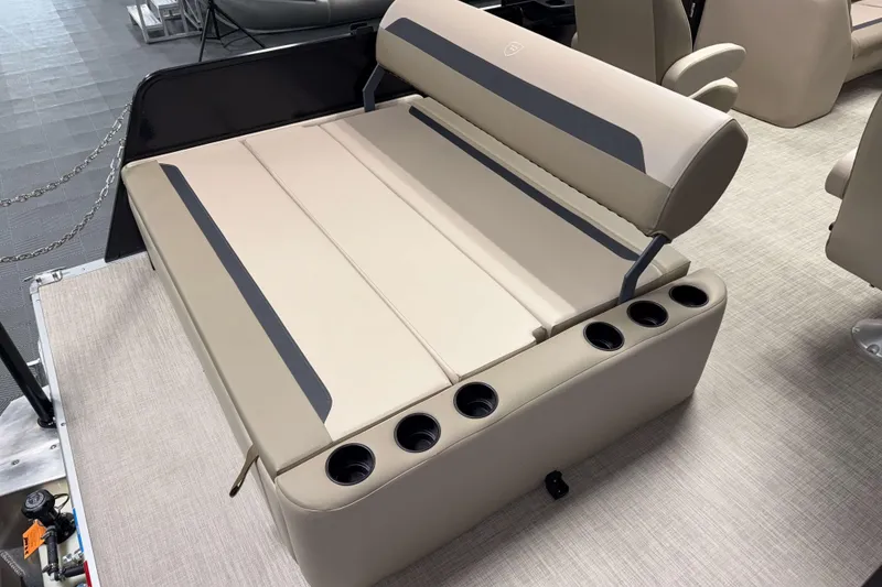 Slide: The Image of 2026 Premier 200 Sunscape RL boat seating with cup holders, beige upholstery, and modern design. - 12