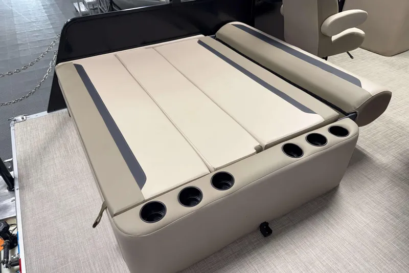 Slide: The Image of Luxurious seating on 2026 Premier 200 Sunscape RL boat with integrated cup holders. - 13